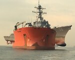 SINGAPORE – (Oct. 7, 2017) – MV Treasure concludes USS John S. McCain (DDG 56) heavy lift operations in the Singapore Strait, Oct. 7. U.S. Navy Supervisor of Salvage and Diving representatives prepared the destroyer for transit to Yokosuka, Japan, later this month.