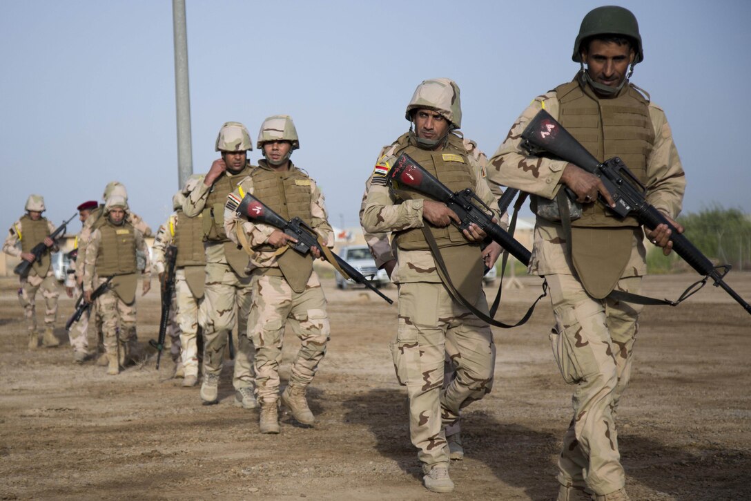 Iraqi troops march together during a training exercise.