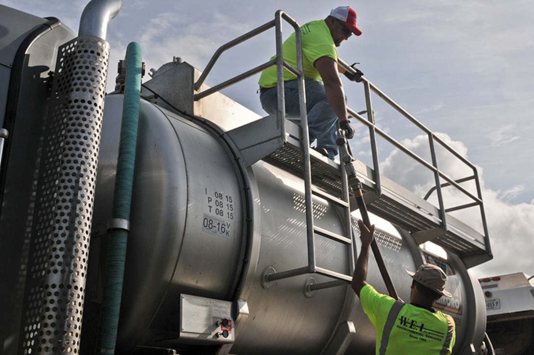 DLA members by fuel truck to transfer fuel to another truck