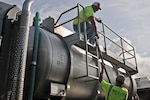 DLA members by fuel truck to transfer fuel to another truck