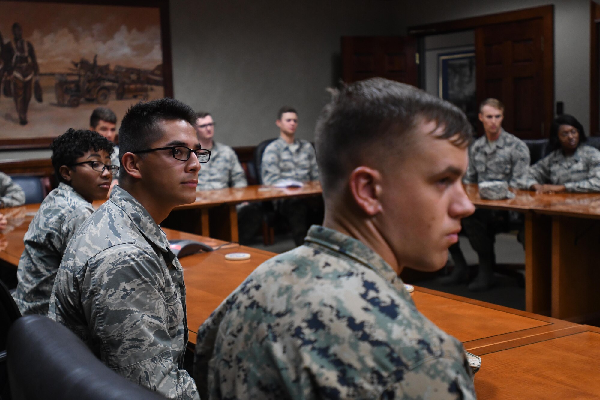 335th Training Squadron weather students attend a video teleconference with Lt. Gen. Richard Clark, 3rd Air Force commander, Ramstein Air Base, Germany, at Stennis Hall Oct. 12, 2017, on Keesler Air Force Base, Mississippi. Airmen delivered a mission and regional weather forecast to Clark as a training demonstration as well as a mentorship opportunity. (U.S. Air Force photo by Kemberly Groue)