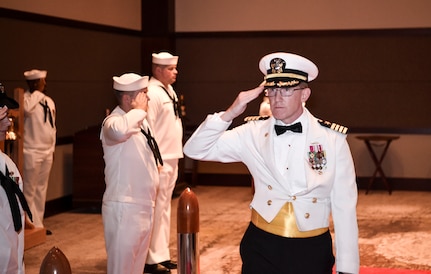 Capt. Robert E. Hudson Deputy Commander, Joint Base Charleston and Commanding Officer, Naval Support Activity Charleston, salutes the Side Boys as he enters the Navy’s 242nd birthday ball in Charleston, S.C., Oct. 14, 2017.