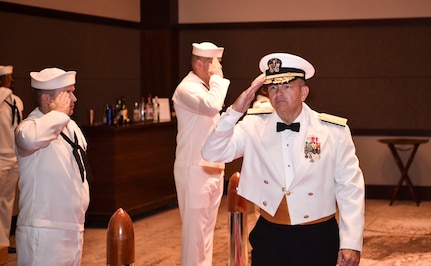 Rear Adm. Jeff Tussler, director of future plans at the Office of the Chief of Naval Operations, salutes the side boys as he enters the Navy’s 242nd birthday ball in Charleston, S.C., Oct. 14, 2017.