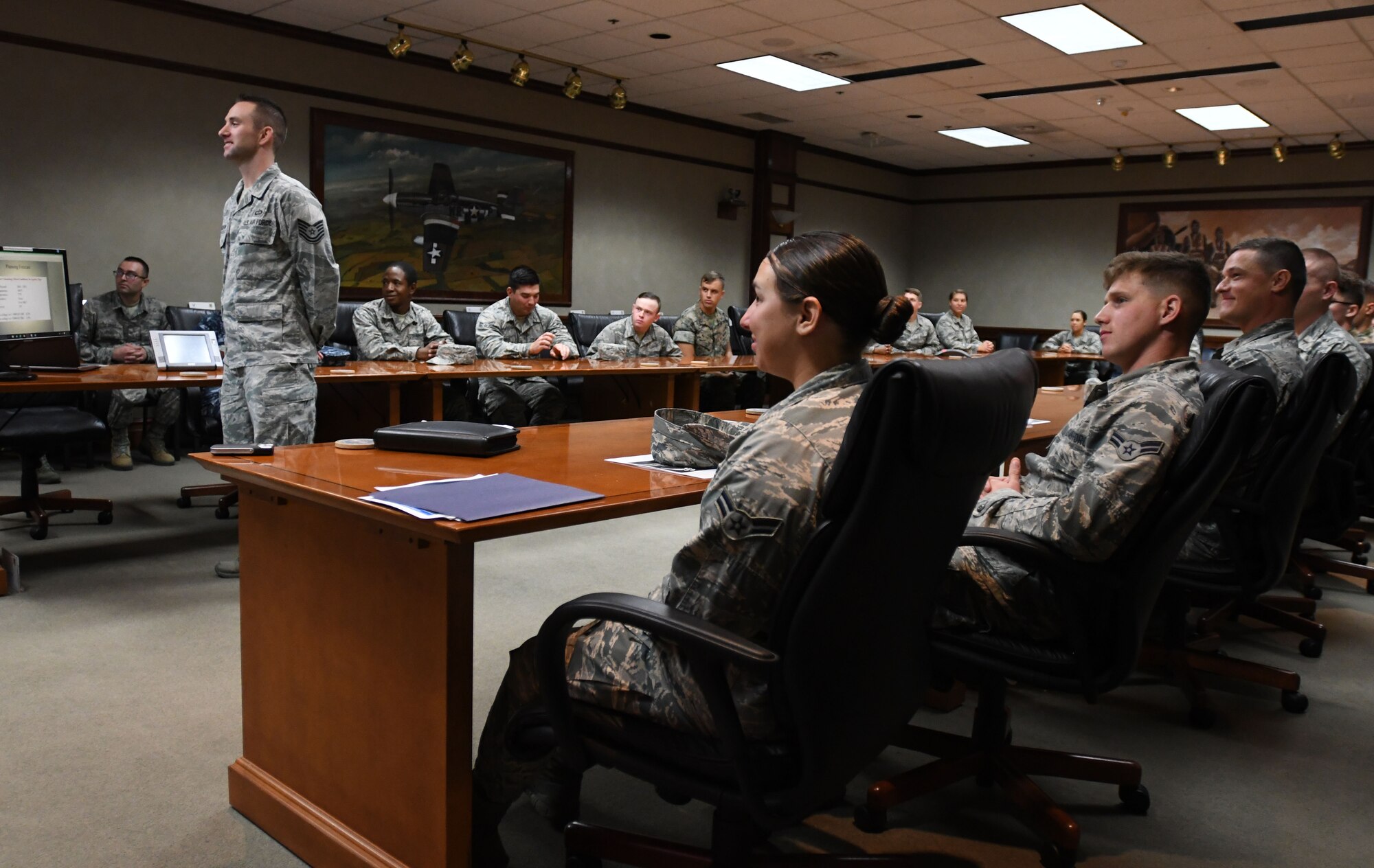 Tech. Sgt. Zachary Ferguson, 335th Training Squadron instructor supervisor, delivers comments to Lt. Gen. Richard Clark, 3rd Air Force commander, Ramstein Air Base, Germany, via a video teleconference at Stennis Hall Oct. 12, 2017, on Keesler Air Force Base, Mississippi. Ferguson’s students delivered a mission and regional weather forecast as a training demonstration as well as a mentorship opportunity. (U.S. Air Force photo by Kemberly Groue)