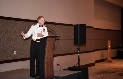 Capt. Robert E. Hudson Deputy Commander, Joint Base Charleston and Commanding Officer, Naval Support Activity Charleston, introduces the guest speaker at the Navy’s 242nd birthday ball in Charleston, S.C., Oct. 14, 2017.