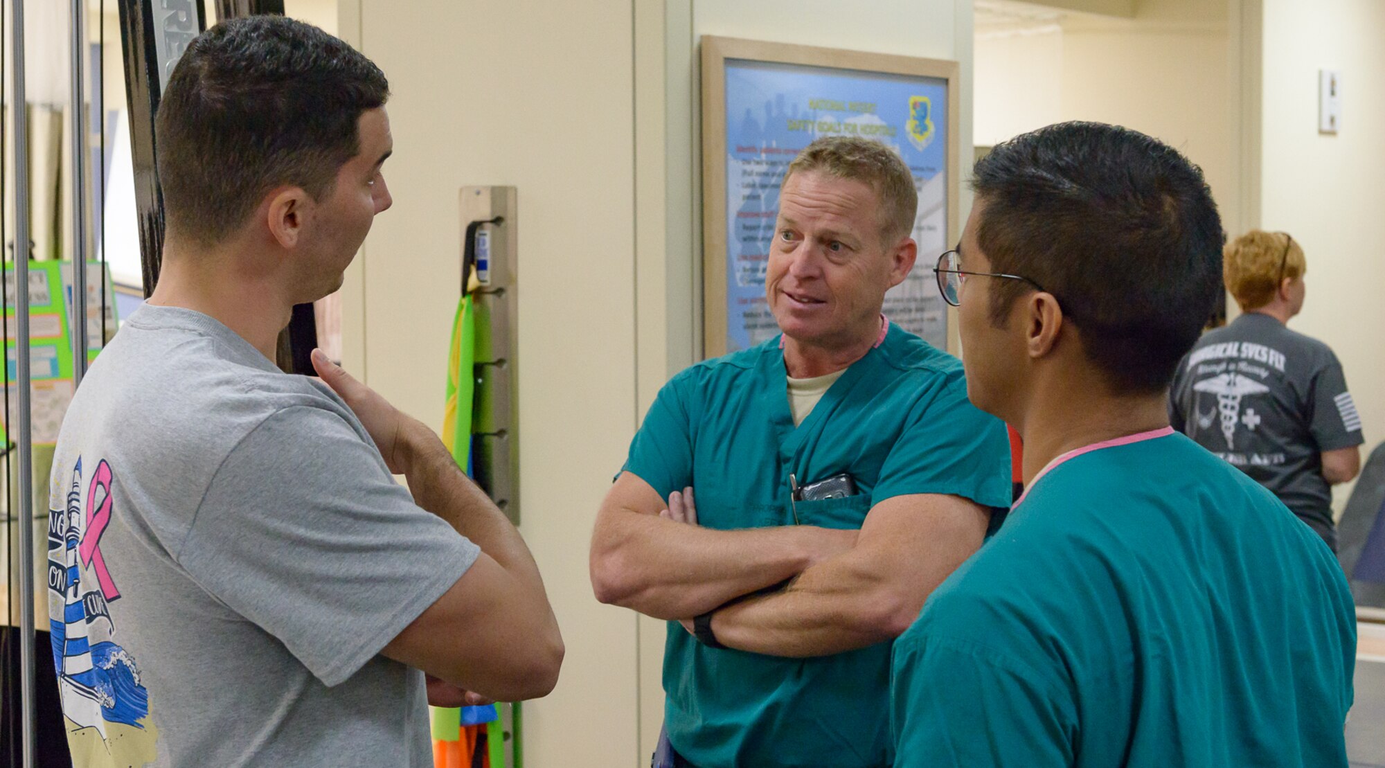 Dr. Andrew Johnson, 81st Surgical Operations Squadron doctor of physical therapy, briefs Lt. Col. Scott Pointer, 81st MSGS anesthesiology element lead, and Capt. Chris Fontimayor, 81st MSGS anesthetist, on physical therapy health benefits at the Physical and Occupational Therapy clinic open house Oct. 13, 2017, on Keesler Air Force Base, Mississippi. The event was held in celebration of National Physical Therapy and Chiropractic Month and housed several demonstrations to include dry needling, anti-gravity treadmill and power lifting techniques. (U.S. Air Force photo by Andre’ Askew)