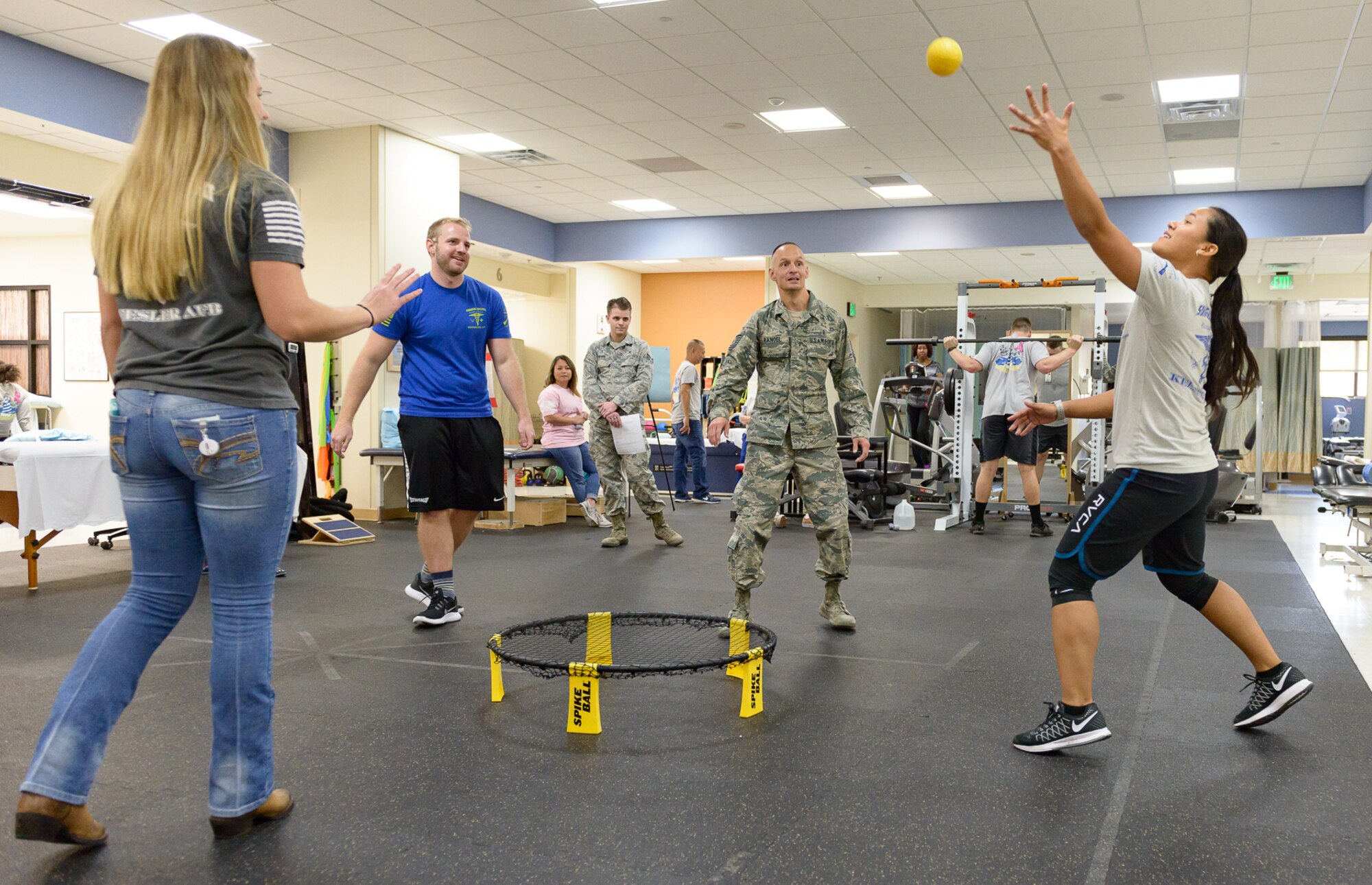 Keesler personnel test their range of motion by playing a game at the Physical and Occupational Therapy clinic open house Oct. 13, 2017, on Keesler Air Force Base, Mississippi. The event was held in celebration of National Physical Therapy and Chiropractic Month and housed several demonstrations to include dry needling, anti-gravity treadmill and power lifting techniques. (U.S. Air Force photo by Andre’ Askew)