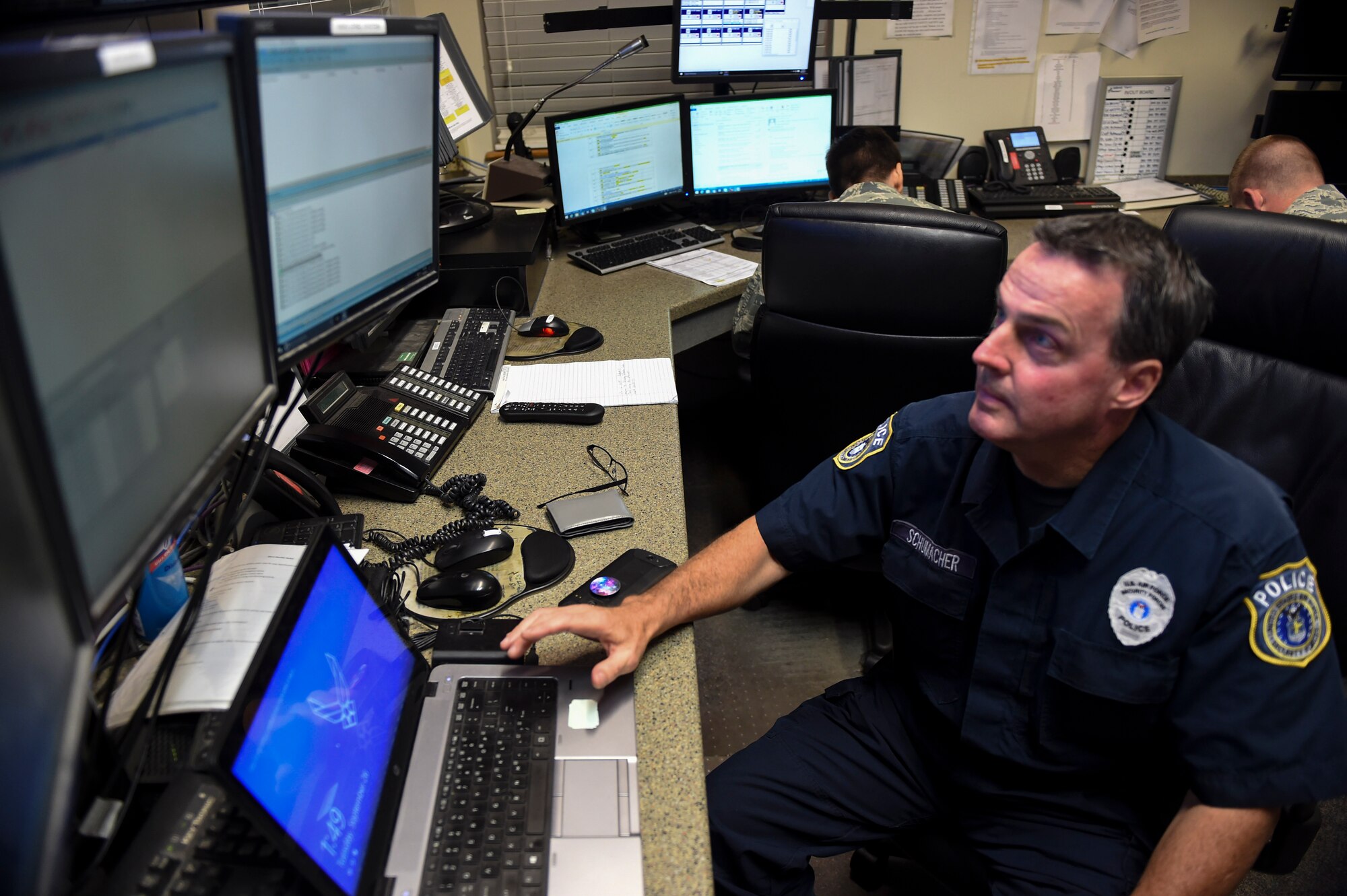 Michael Schumacher, 628th Security Forces Squadron patrolmen, age 55, views the base security monitors in the maintenance operations center at Joint Base Charleston, S.C., Sept. 26.