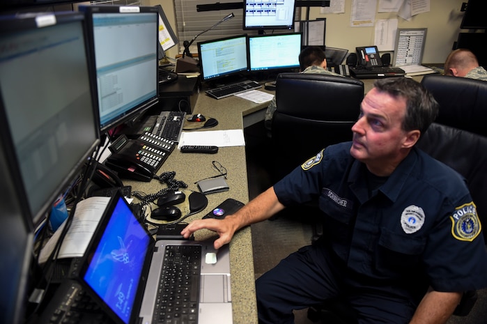 Michael Schumacher, 628th Security Forces Squadron patrolmen, age 55, views the base security monitors in the maintenance operations center at Joint Base Charleston, S.C., Sept. 26.