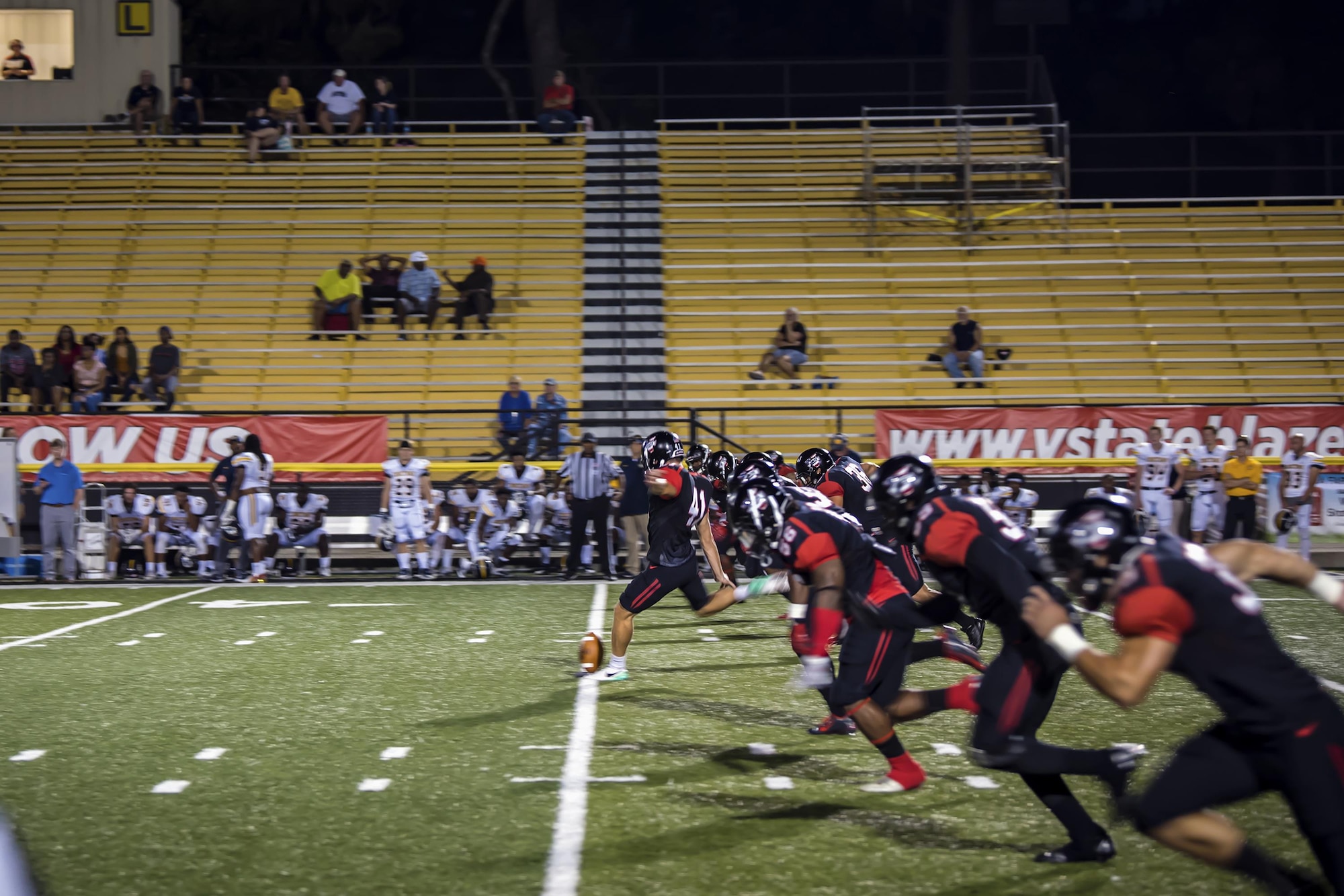 Players from Valdosta State University (VSU) run down the field to kick off a military appreciation day football game, Oct. 15, 2017, in Valdosta, Ga. VSU faced off against Mississippi College where VSU was victorious by a score of 55-3. (U.S. Air Force photo by Airman Eugene Oliver)