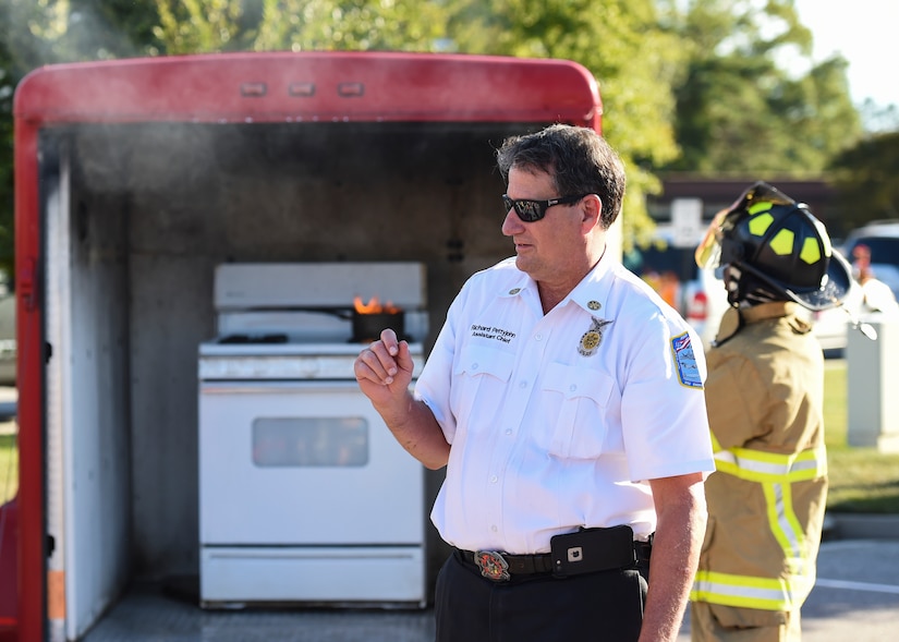 Richard Pettyjohn, 633rd Civil Engineer Squadron Fire Department assistant chief, prepares attendees for a kitchen fire display at Bethel Manor Housing, Yorktown, Va., Oct. 6, 2017.