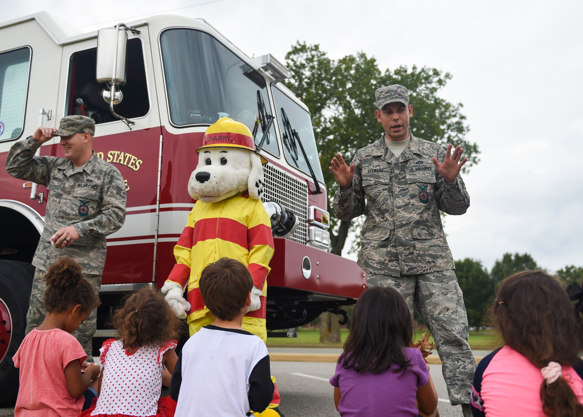 U.S. Air Force Airmen assigned to the 633rd Civil Engineer Squadron Fire Department, interact with children from the Child Development Center at Joint Base Langley-Eustis, Va., Oct. 10, 2017.