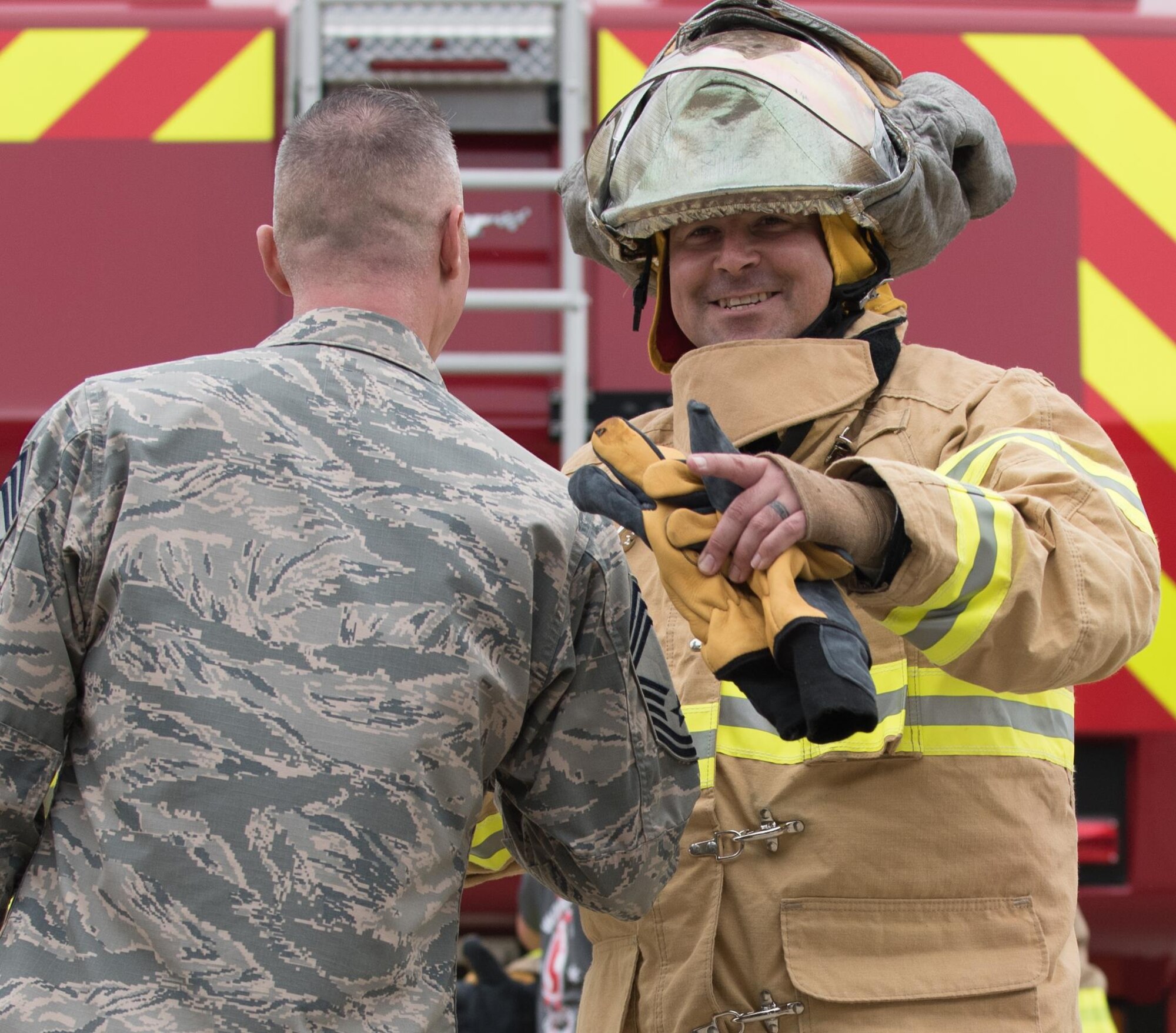 U.S. Air Force Chief Master Sgt. Matthew Mancill, Firefighter Combat Challenge 633rd Mission Support Group team member, celebrates after completing the challenge at Joint Base Langley-Eustis, Va., Oct. 13, 2017.