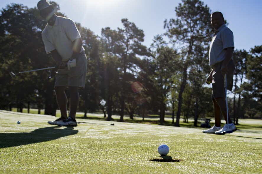 Retired Master Sgt. David Charles, sinks a putt during a Retiree Appreciation Week golf tournament, Oct. 13, 2017, at the Quiet Pines golf course on Moody Air Force Base, Ga. Retired Chief Master Sgt. James Ingram, director of the Retiree Affairs Office, created the annual event in the 1990’s to bring retirees together and make them feel welcomed in the base community. (U.S. Air Force photo by Senior Airman Daniel Snider)