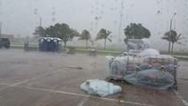 Rain and wind pelts the annual tour worksite of the 35th Combat Communications Squadron at Homestead Air Reserve Base, Florida, during south Florida’s wettest week in 26 years.