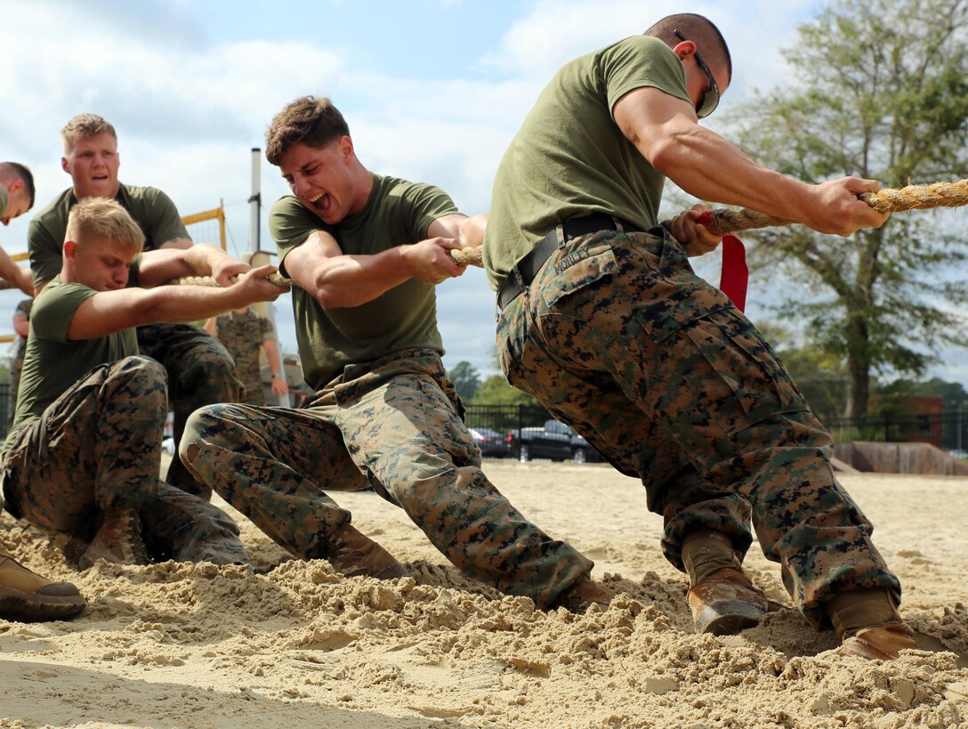 Marines assigned to 2nd Low Altitude Air Defense Battalion dig deep for the strength to win the final match of the 2017 Combined Federal Campaign Tug-of-War Tournament at Marine Corps Air Station Cherry Point, N.C., Oct. 13, 2017. The mission of the CFC is to promote and support philanthropy through a program that is employee focused, cost-efficient, and effective in providing all federal employees the opportunity to improve the quality of life for others. 2nd LAAD Bn. has won the event in back-to-back years, making them only the second unit to accomplish this feat. 2nd LAAD Bn. is assigned to Marine Air Control Group 28, 2nd Marine Aircraft Wing. (U.S. Marine Corps photo by Pfc. Andrew King/Released)