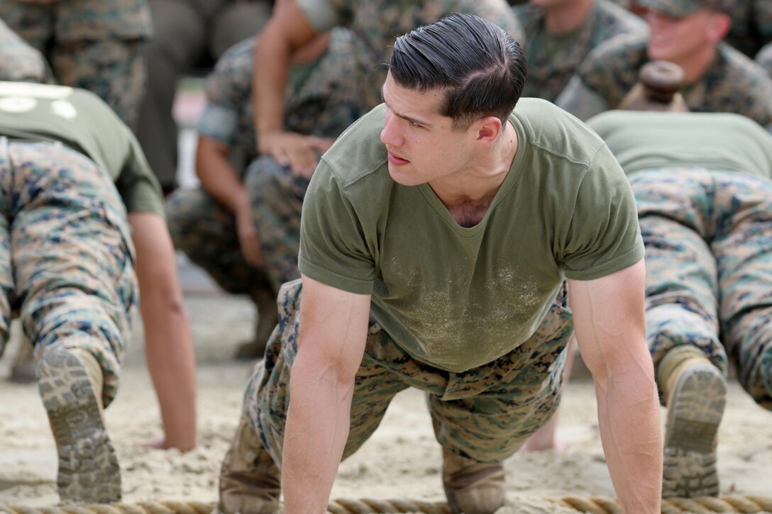 1st Lt. Howard Mill readies for the command to pull in the 2017 Combined Federal Campaign Tug-of-War Tournament at Marine Corps Air Station Cherry Point, N.C., Oct. 13, 2017. The mission of the CFC is to promote and support philanthropy through a program that is employee focused, cost-efficient, and effective in providing all federal employees the opportunity to improve the quality of life for others. Mill is a low altitude air defense officer assigned to 2nd Low Altitude Air Defense Battalion, Marine Air Control Group 28, 2nd Marine Aircraft Wing. (U.S. Marine Corps photo by Cpl. Cody Lemons/Released)