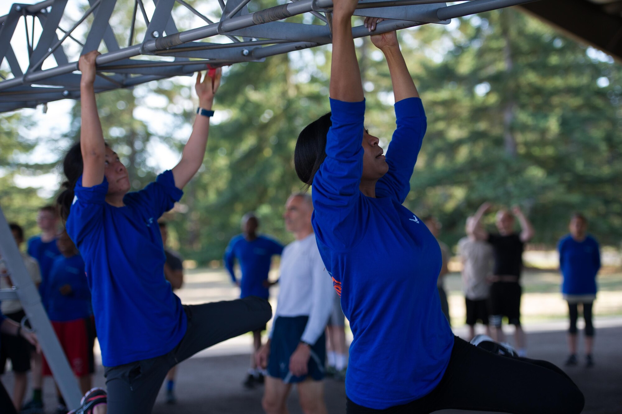 Members of the Development and Training Flight train during a physical fitness session at the McChord Field track Oct. 15. (U.S. Air Force photo by 1st Lt. Alyssa Hudyma)