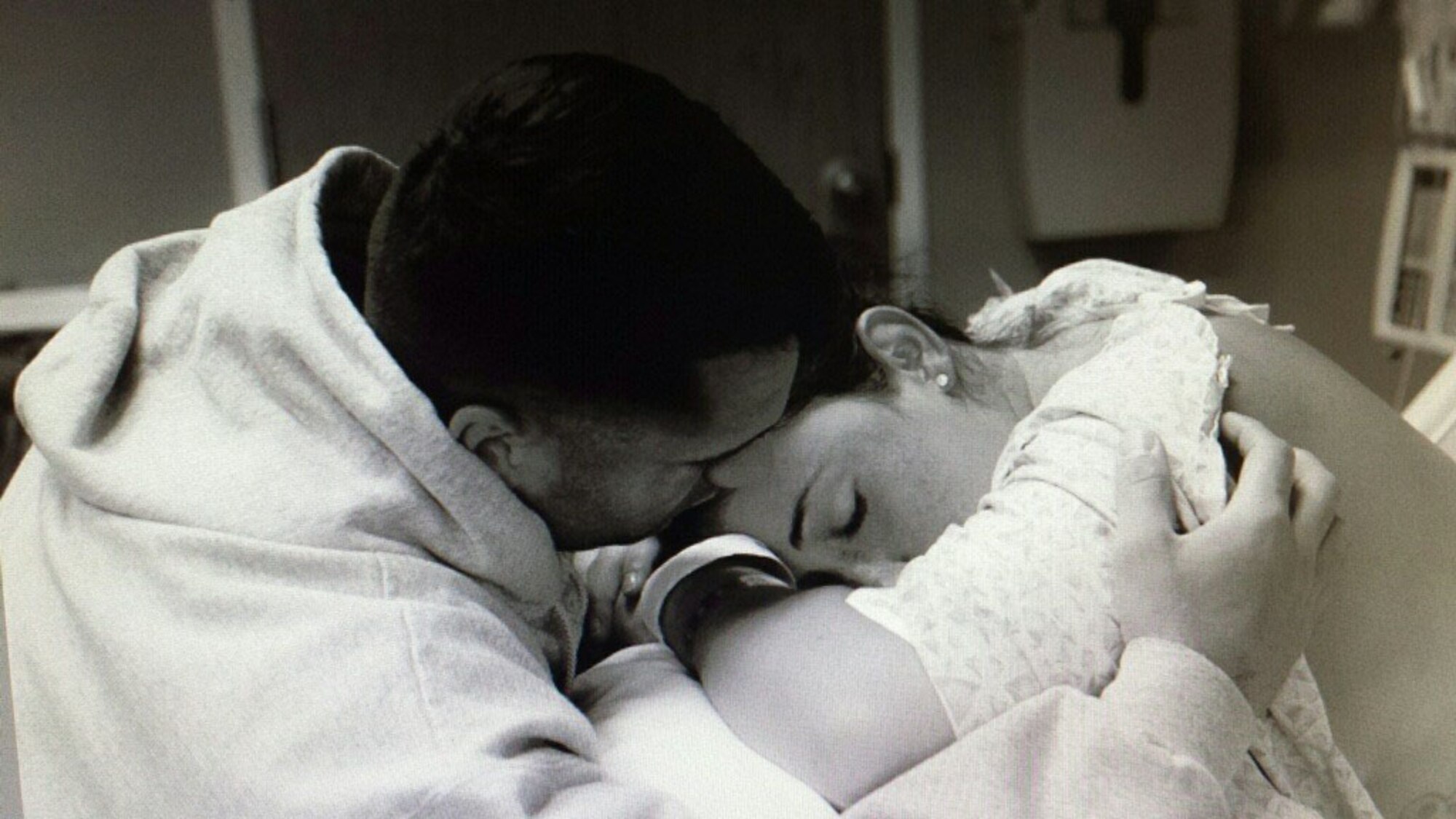 Maj. Joseph Picariello, National Security Space Institute assistant course director, comforts his wife, Staff Sgt. Erica Picariello, 21st Space Wing Public Affairs non-commissioned officer in-charge, during labor with their third son, Luciano, in an undated photo. The Picariellos endured three miscarriages over the span of five years before bringing home their rainbow baby. A “rainbow baby” is a term commonly used to describe a baby born after loss. (Courtesy photo)