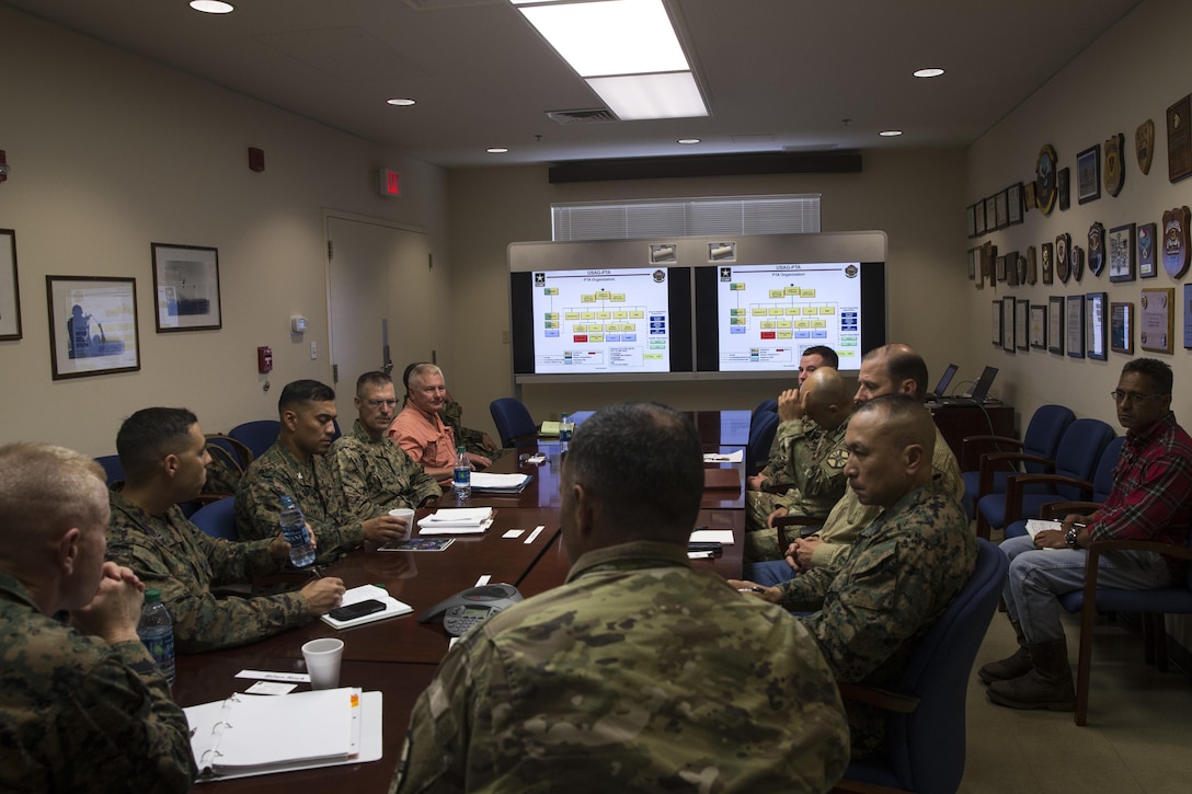 U.S. Marine Corps Brig. Gen. Paul Rock Jr., Marine Corps Installations Pacific commanding general, along with Marines and civillian from Marine Corps Base Hawaii (MCBH) receive a brief from U.S. Army Lt. Col. Christopher Marquez,  commanding officer of Pōhakuloa Training Area, Hawaii, Oct. 11, 2017. Brig. Gen. Rock visited MCBH and its various bases to survey the Marines and their infrastructure, training and operations. (U.S. Marine Corps Photo by Sgt. Alex Kouns)