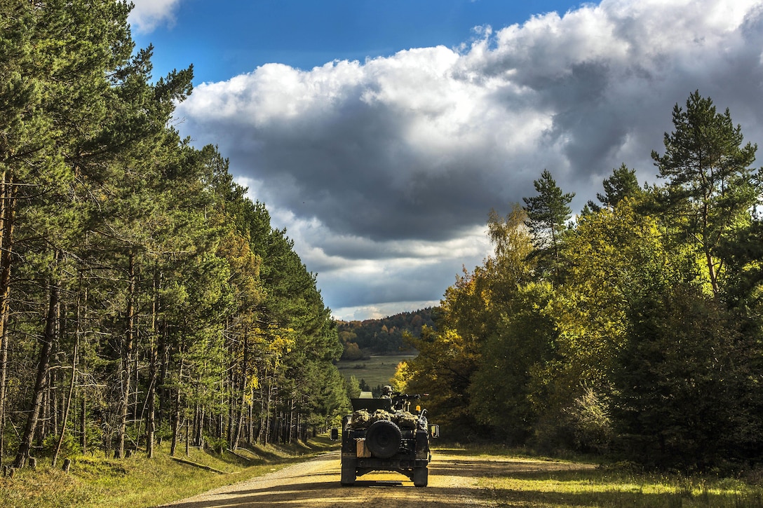 A vehicle drives on a road.