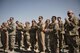 Attendees cheer as Lt. Col. Scott May assumed command of the 332nd Expeditionary Maintenance Squadron during a change of command ceremony October 6, 2017 in Southwest Asia. The 332nd EMXS is responsible for all aspects of maintenance on F-15E Strike Eagles supporting Operation Inherent Resolve. (U.S. air Force photo by Senior Airman Joshua Kleinholz)