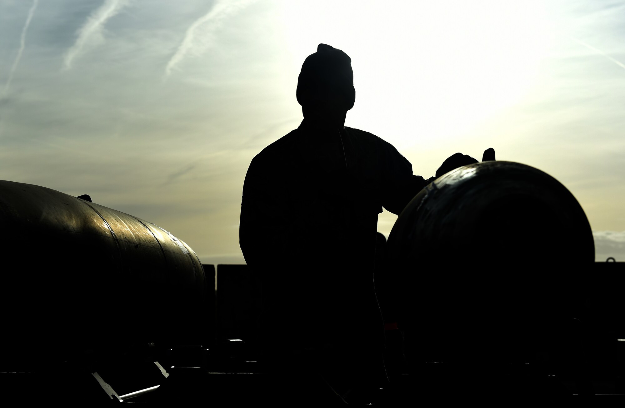 U.S. Air Force Airman 1st Class Andre McRae, 7th Munitions Squadron munitions specialist inspects the outside of a guided bomb unit, at RAF Fairford, U.K., Oct. 12, 2017. The 7th MUNS participated in real-time training for various B-1B Lancer exercises in Europe in support of the U.S. Air Forces in Europe. (U.S. Air Force photo by Airman 1st Class Emily Copeland)