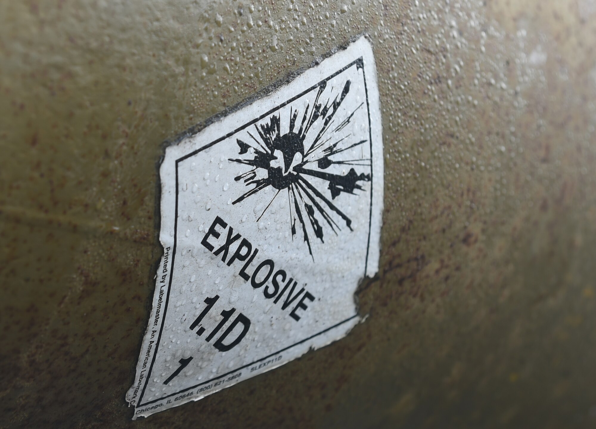 An explosive warning is visible on a guided bomb unit during the assembly of live munitions at Royal Air Force Fairford, U.K., Oct. 12, 2017. The B-1B Lancer carries the largest payload of both guided and unguided weapons in the U.S. Air Force inventory and can rapidly deliver massive quantities of precision and non-precision munitions. (U.S. Air Force photo by Airman 1st Class Emily Copeland)