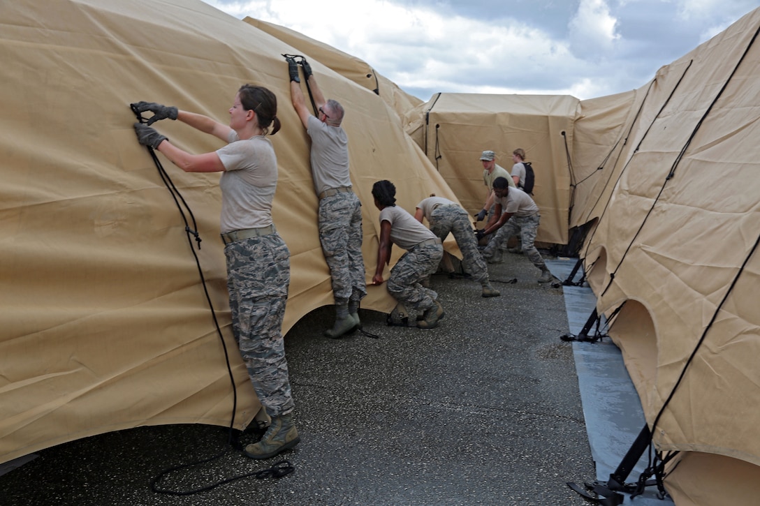 Airmen provide medical tents for evaluations.