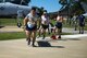 Airmen assigned to the 23d Civil Engineer Squadron carry a simulated casualty during a stretcher carry event as part of the 2017 Fire Prevention Week Fire Muster, Oct. 13, 2017, at Moody Air Force Base, Ga. The 23d Civil Engineer Squadron fire department designed the muster to allow teams of Airmen to compete in several events, ranging from a hose roll to a fire truck pull. Event organizers wanted Airmen to experience being a firefighter in a way that got people active. (U.S. Air Force photo by Airman 1st Class Erick Requadt)