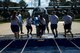 Airmen assigned to the 23d Security Force Squadron run to fill a trash can with water in the “bucket brigade” event during the 2017 Fire Prevention Week Fire Muster, Oct. 13, 2017, at Moody Air Force Base, Ga. The 23d Civil Engineer Squadron fire department designed the muster to allow teams of Airmen to compete in several events, ranging from a hose roll to a fire truck pull. Event organizers wanted Airmen to experience being a firefighter in a way that got people active. (U.S. Air Force photo by Airman 1st Class Erick Requadt)