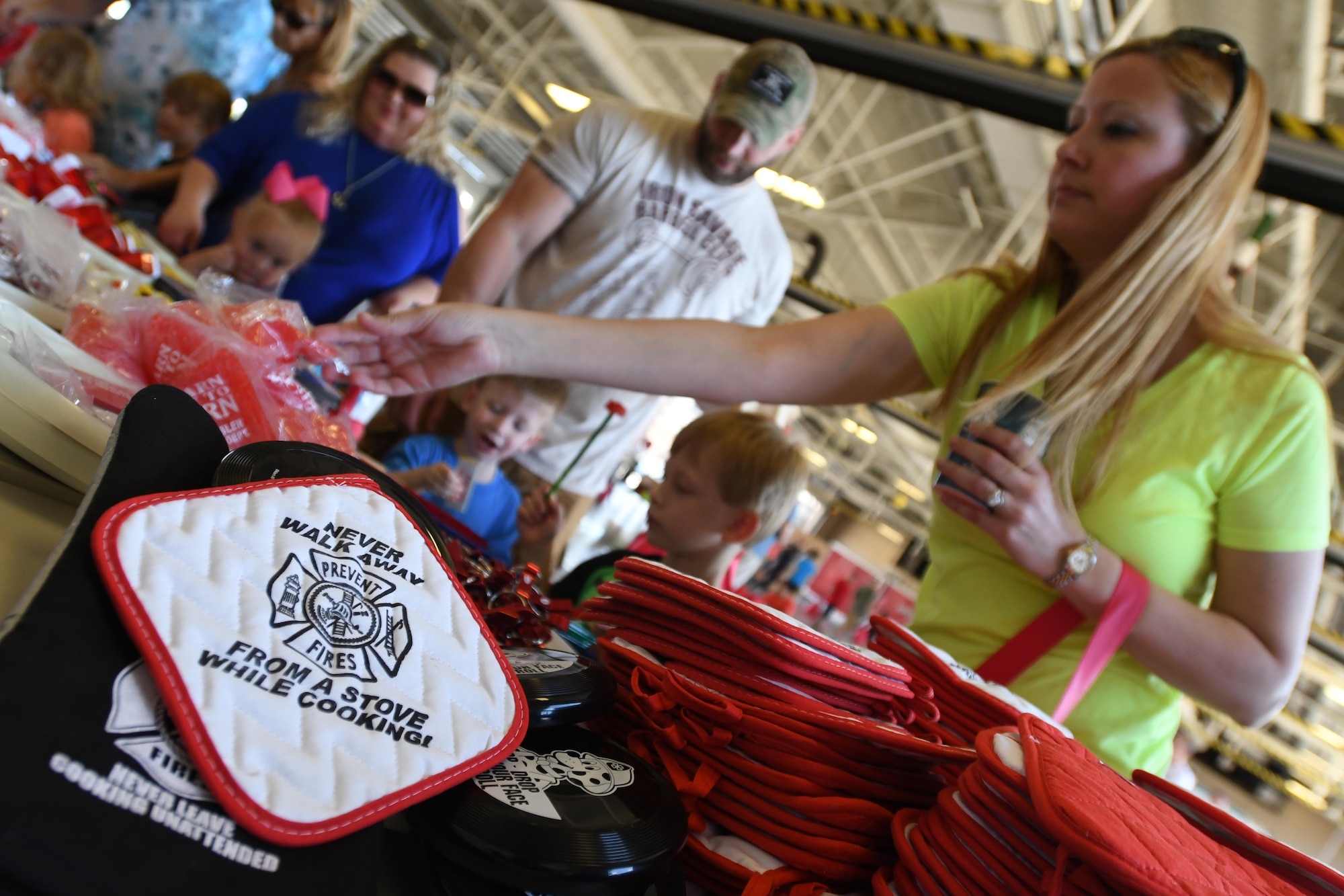 Keesler families collect gifts during the Keesler Fire Department open house at the fire station Oct. 14, 2017, on Keesler Air Force Base, Mississippi. The open house was the concluding event to Fire Prevention Week. Throughout the week the Keesler Fire Department conducted random fire drills, toured various facilities with Sparky the Fire Dog, passed out fire safety information and fire hats for children and provided stove and fire extinguisher demonstrations. (U.S. Air Force photo by Kemberly Groue)