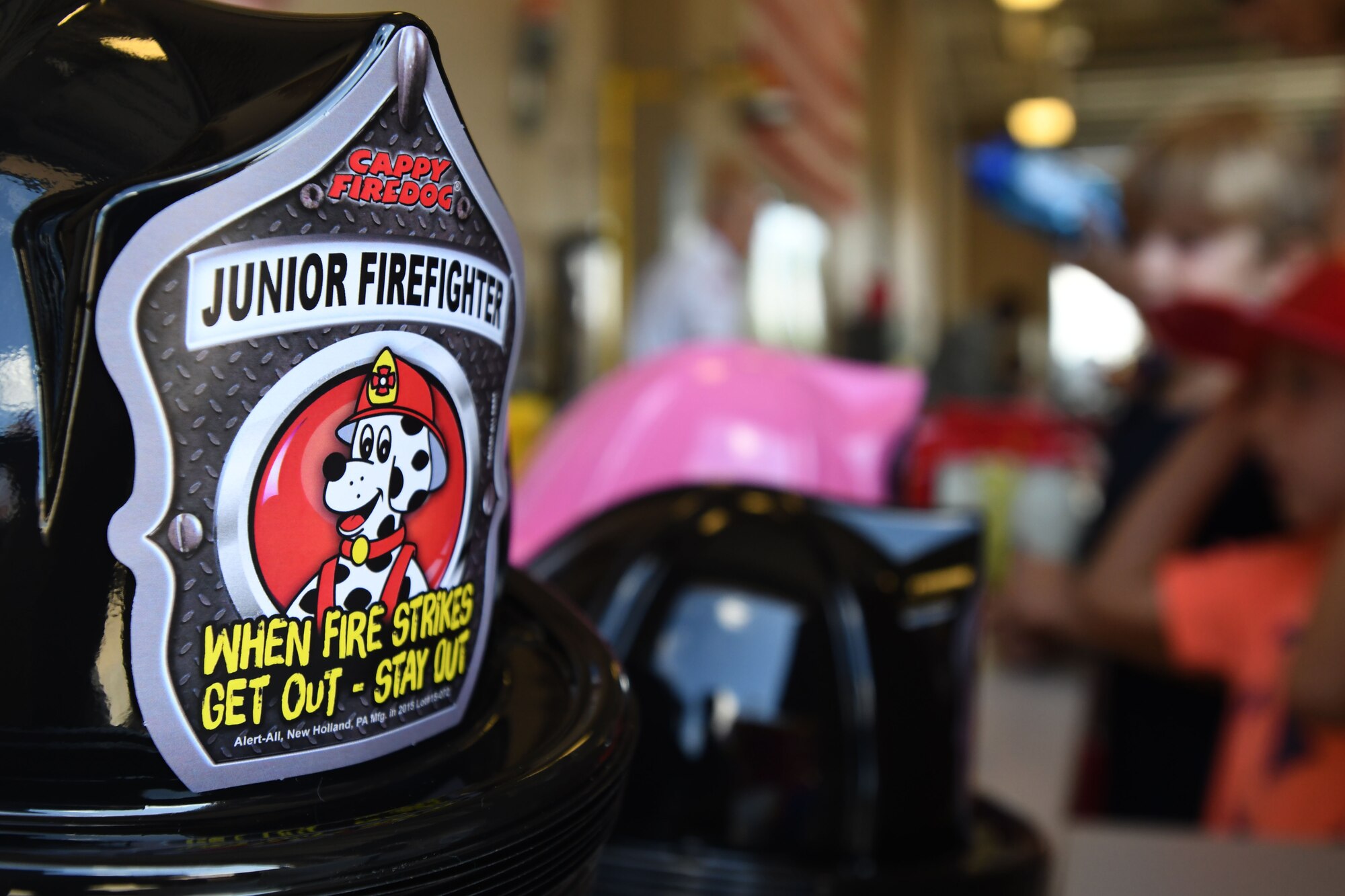Plastic firefighter hats are on display at the Keesler Fire Department open house at the fire station Oct. 14, 2017, on Keesler Air Force Base, Mississippi. The open house was the concluding event to Fire Prevention Week. Throughout the week the Keesler Fire Department conducted random fire drills, toured various facilities with Sparky the Fire Dog, passed out fire safety information and fire hats for children and provided stove and fire extinguisher demonstrations. (U.S. Air Force photo by Kemberly Groue)
