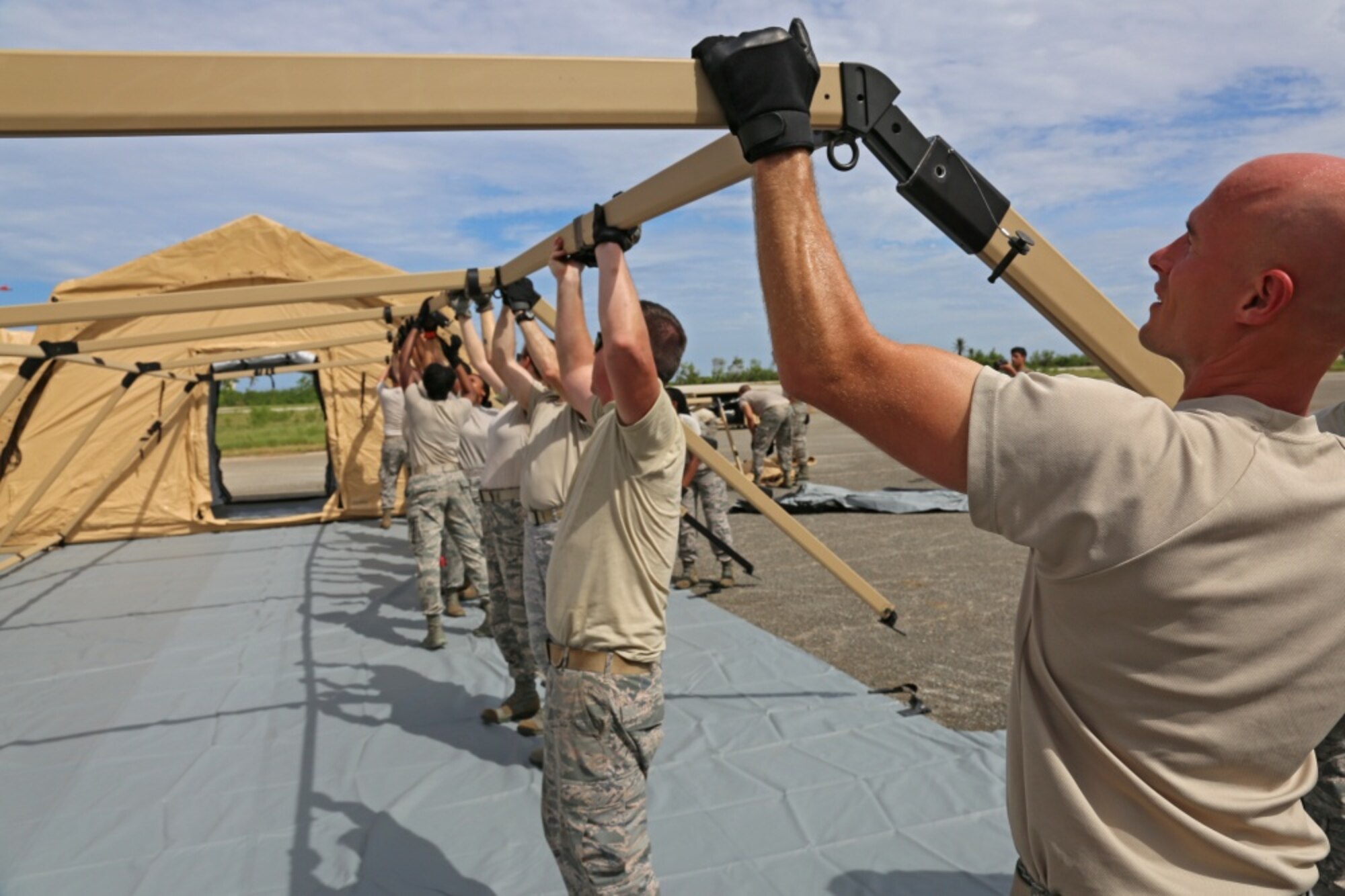 U.S. Airmen assigned to 633rd Medical Group, assemble medical tents, Aguadilla, Puerto Rico, Oct. 16, 2017. The 633rd Medical Group is conducting medical evacuation and relief efforts to support FEMA in the recovery process of Puerto Rico after the devastation created by Hurricane Maria. 
(U.S. Army photo by Sgt. Nelson Rodriguez)