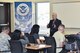 Jesse Mendez, U.S. Department of Homeland Security U.S. Citizenship and Immigration Services Albuquerque Field Office director, briefs members of Cannon Air Force Base, N.M. during an immigration workshop at the Airmen and Family Readiness Center Oct. 13, 2017. The workshop gives Airmen and those with base access the opportunity to ask specific questions regarding immigration and citizenship. (U.S. Air Force photo by Staff Sgt. Michael Washburn/Released)