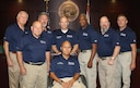 Senior Master Sgt. James Salgado (center, standing) and retired U.S. Army Col. D.J. Reyes (center, seated) with their team of Veterans Treatment Court mentors.