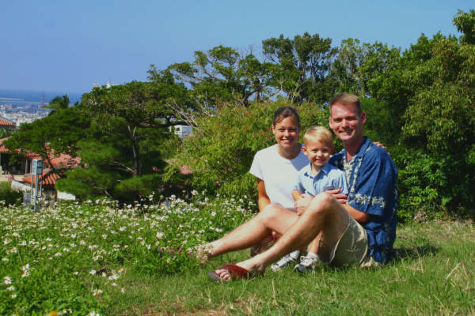 Col. David Miller, 341st Maintenance Group commander, right, his wife Leigh Ann, left, and their son Matthew, take a photo in Okinawa, Japan in 2006.