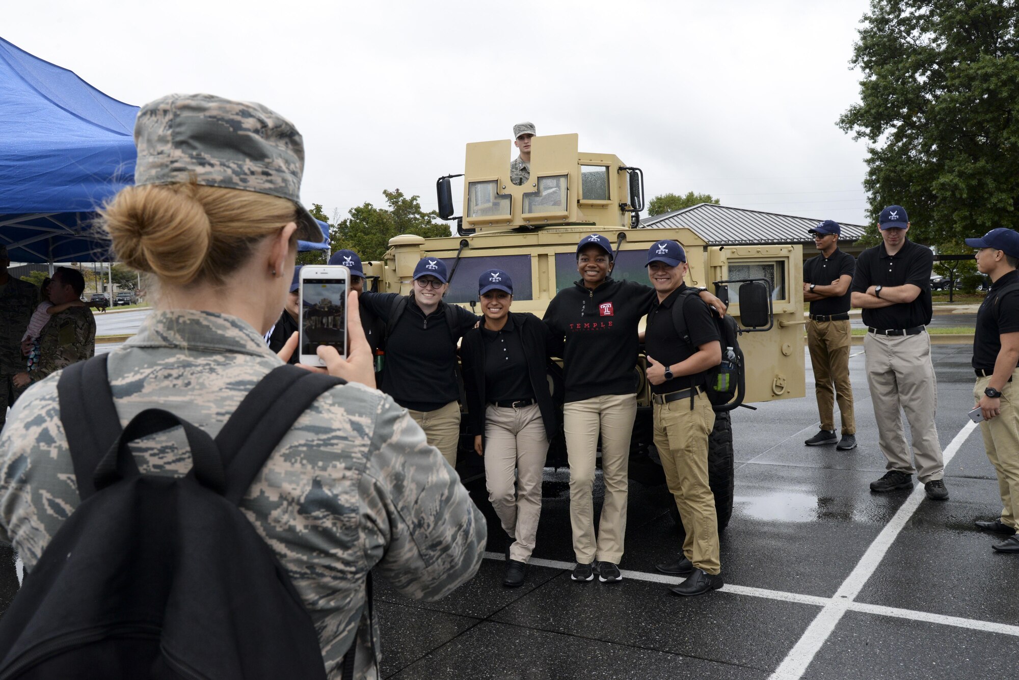 A group of Junior ROTC cadets pose for a group photo in front of a 436th Civil Engineer Squadron explosive ordnance disposal vehicle Oct. 11, 2017, during a Pathways to Blue tour at Dover Air Force Base, Del. In addition to viewing the 436th CES EOD and firefighting vehicles and equipment, cadets also visited the 436th Operations Support Squadron air traffic control tower, the 436th Maintenance Squadron’s C-5M Isochronal Inspection Dock and the 436th Aerial Port Squadron. (U.S. Air Force photo by Staff Sgt. Aaron J. Jenne)