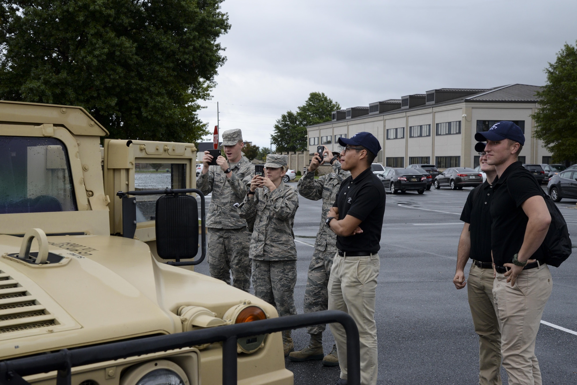 Several ROTC and Junior ROTC cadets take pictures of a 436th Civil Engineer Squadron explosive ordnance disposal vehicle Oct. 11, 2017, during a Pathways to Blue tour at Dover Air Force Base, Del. The cadets learned about practical military organization and how officers fit into the fabric that makes up military units. (U.S. Air Force photo by Staff Sgt. Aaron J. Jenne)