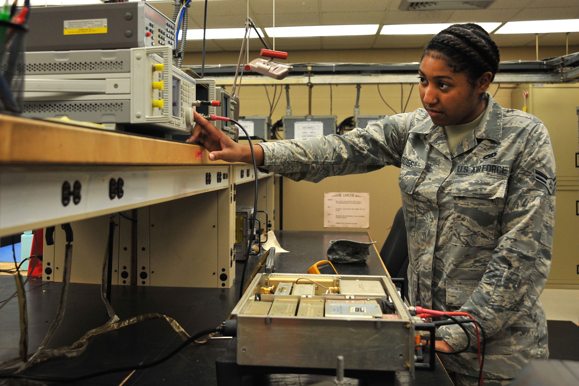 U.S. Air Force Airman 1st Class Darricka Sides, 20th Operations Support Squadron airfield systems technician, sets up a signal generator for radio receiver tuning at Shaw Air Force Base, S.C., Oct. 4, 2017.