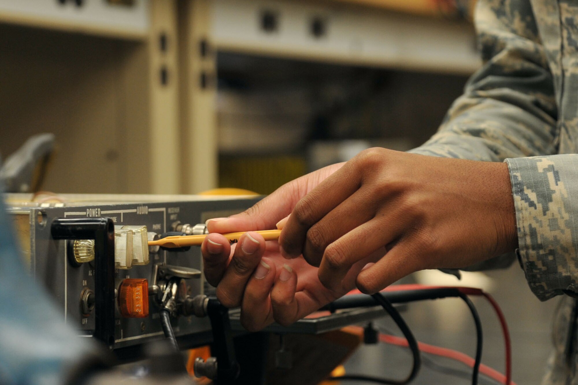 U.S. Air Force Airman 1st Class Darricka Sides, 20th Operations Support Squadron (OSS) airfield systems technician, adjusts a radio receiver for audio cut-off levels at Shaw Air Force Base, S.C., Oct. 4, 2017.