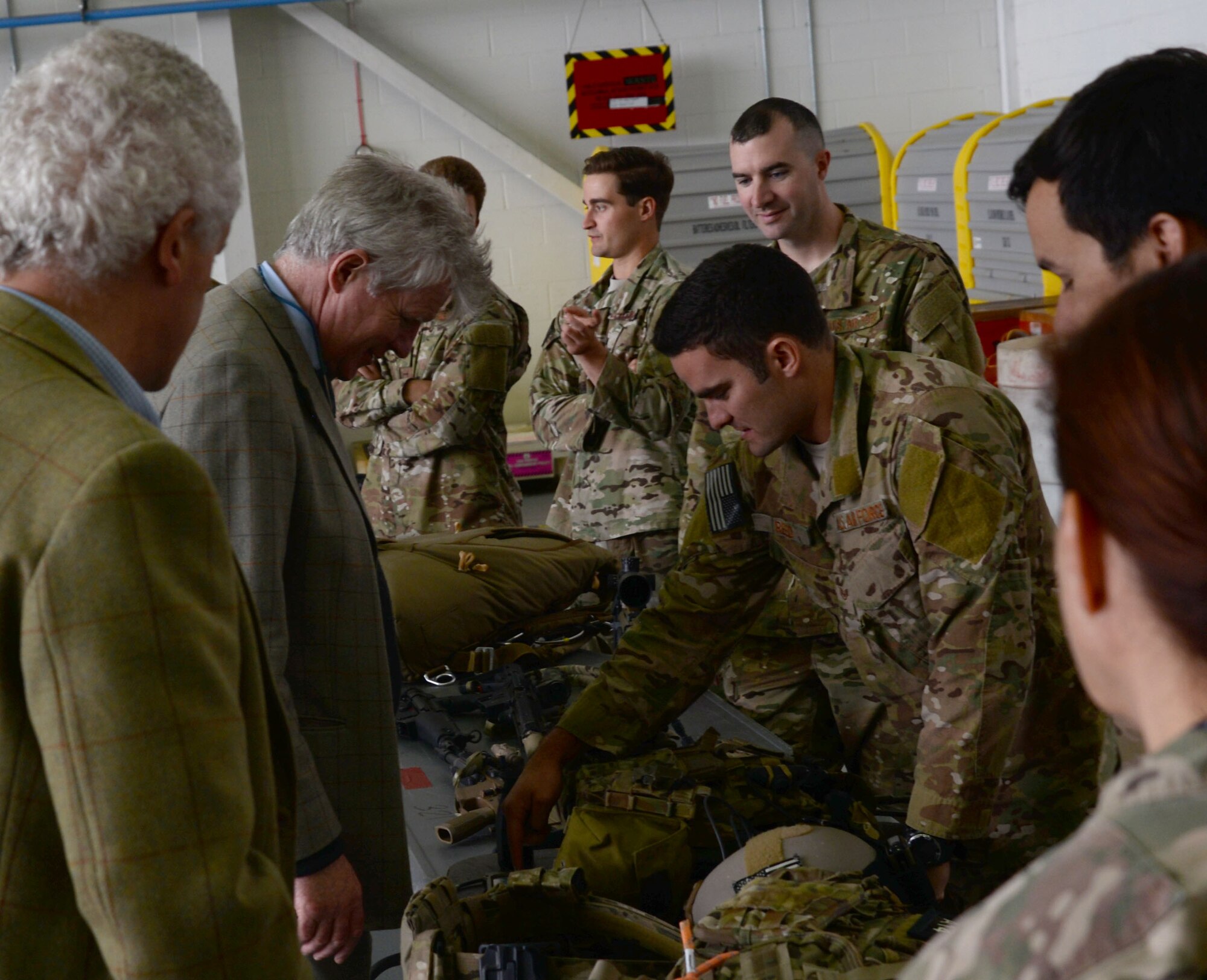 U.S. Air Force Airmen describe weapons and support equipment utilized by 321st Special Tactics Squadron Air Commandos to local high sheriffs, Oct. 13, 2017, on RAF Mildenhall, England. High sheriffs are appointed for one year as active and supportive community leaders in relations to emergency responders, public and volunteer sector organizations involved in crime reduction and social cohesion. Three members of the Office of High Sheriffs toured both RAF Mildenhall and RAF Lakenheath. (U.S. Air Force photo by Senior Airman Justine Rho)