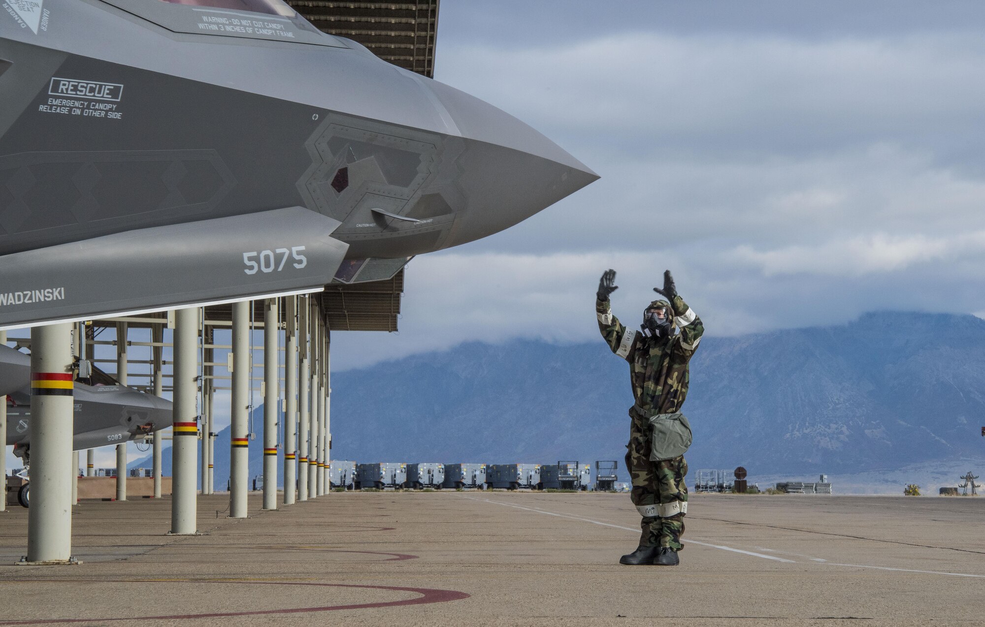 Tech. Sgt. Lance Dooley, a crew chief in the 419th Aircraft Maintenance Squadron, signals to the pilot of an F-35 Lightning II