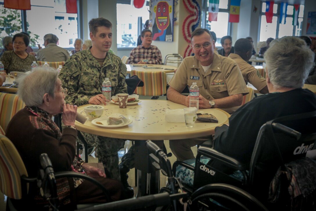 U.S. Marines and Sailors with Combat Logistics Battalion 11, Headquarters Regiment, 1st Marine Logistics Group joined senior citizens at the Mercy Housing, Mission Creek Senior Community Oct. 3, 2017, in San Francisco during San Francisco Fleet Week. The Marines spent time with the senior citizens, participating in activities with them such as bingo, bowling and Nintendo Wii.(U.S. Marine Corps photo by Lance Cpl. Gabino Perez)