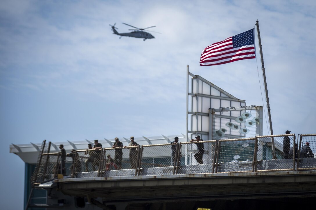 Marines and Sailors look at the city of San Diego, Calif., while aboard USS Anchorage (LPD 23) Oct. 11, 2017 as part of San Diego Fleet Week. Fleet week provides an opportunity for the American public to meet their Marine Corps, Navy and Coast Guard team and experience America's sea services. (U.S. Marine Corps photo by Lance Cpl. Gabino Perez)