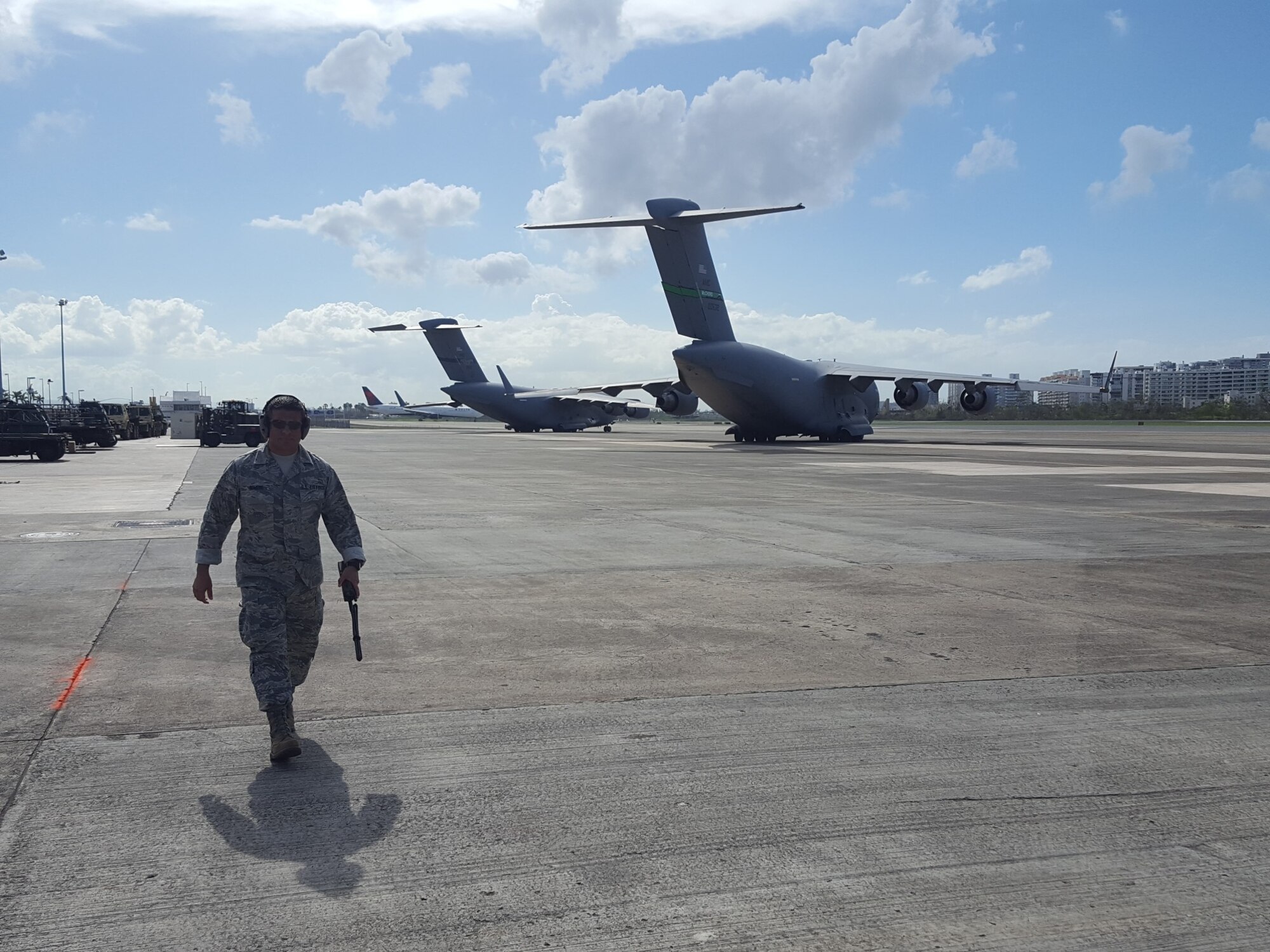 Master Sgt. Alan Romero, an airfield manager for the 167th Airlift Wing, provides support to airfield operations at the Luis Munoz Marin International Airport in San Juan, Puerto Rico. Romero deployed to San Juan shortly after Hurricane Maria devastated the island last month.