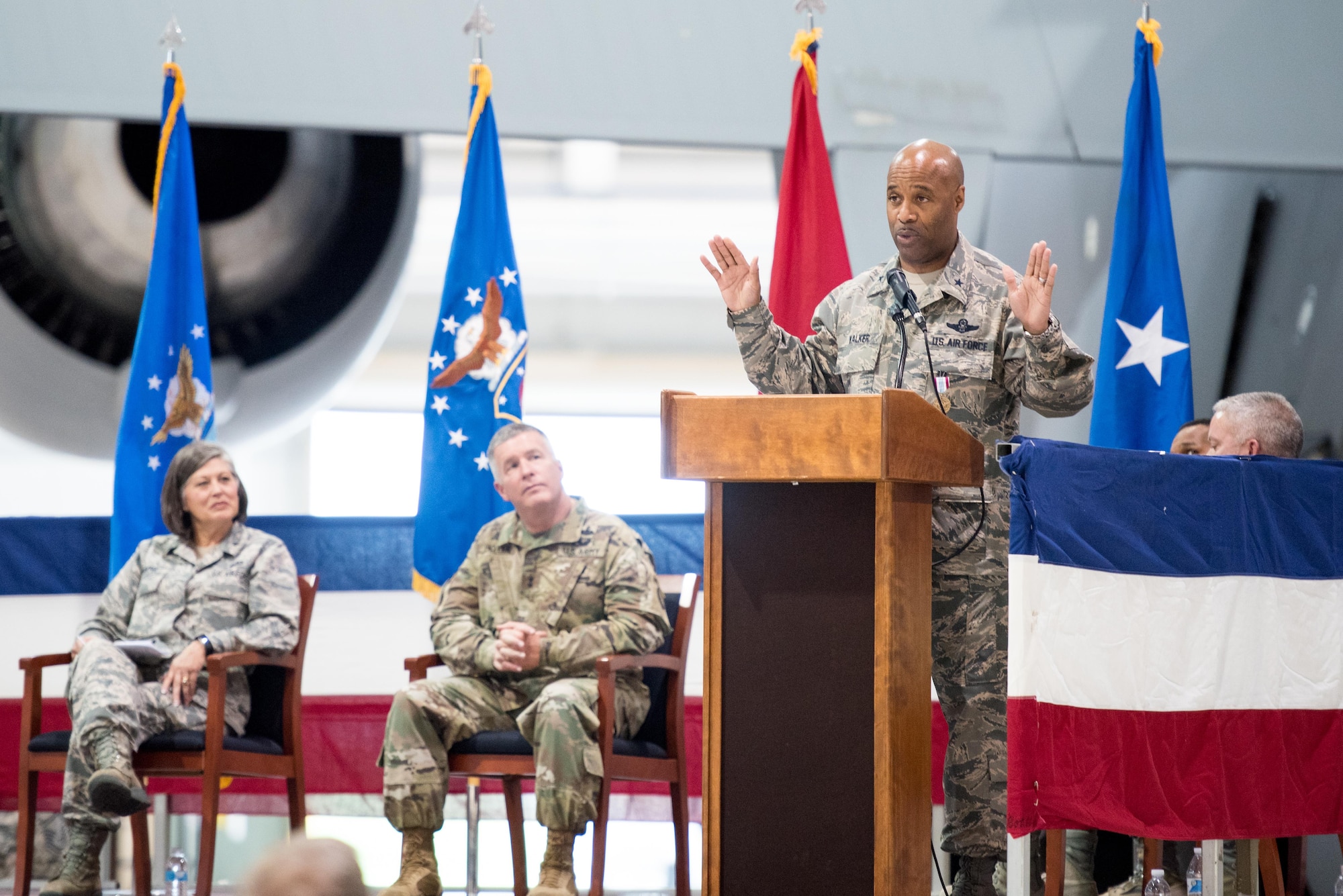 Brig. Gen. Christopher "Mookie" Walker, Chief of Staff for the West Virginia Air National Guard, makes remarks during his promotion ceremony held at the 167th Airlift Wing, Martinsburg W.Va., Oct. 14. Seated behind him are Brig. Gen. Paige Hunter, the Assistant Adjutant General for Air of the West Virginia National Guard and Maj. Gen. James Hoyer, the Adjutant General for the West Virginia National Guard. (U.S. Air National Guard photo by Staff Sgt. Jodie Witmer)