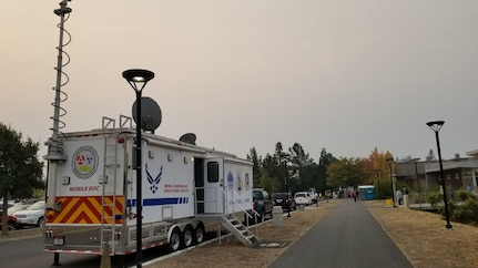 A Mobile Emergency Operations Center (MEOC) from the California Air National Guard's 163d Attack Wing at March Air Reserve Base, is set up at Napa Valley College in Napa, California, to provide communications support to victims of the Northern California fires Oct. 11, 2017.