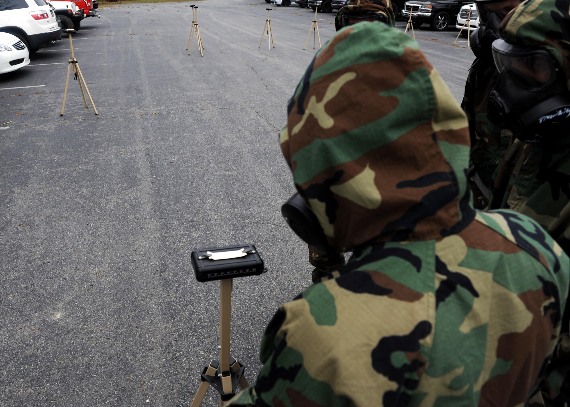 Airmen inspect a cordoned area during Chemical, Biological, Radiological, Nuclear and high-yield Explosives training Oct. 10, 2017, at little Rock Air Force Base, Ark. CBRNE training refreshes Airmen in the proper procedures to take when in contact with a contaminated substance. (U.S. Air Force photo by Airman 1st Class Grace Nichols)
