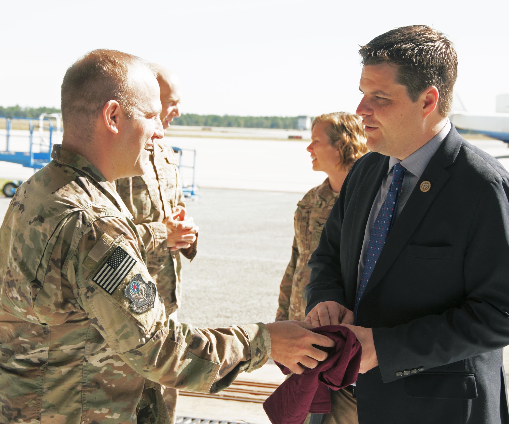 t. Col. Cary Mittelmark, 524th Special Operations Squadron commander, presents a Florida State University t-shirt and squadron coin